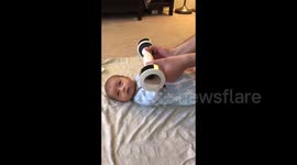 This three-month-old baby weight lifting is adorable