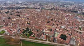 Aerial shot, beautiful panorama of Lucca city, an ancient town in the middle of Tuscany, Italy, filmed with drone, 4K