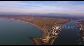Aerial shot of small port in the winter sunset in Pisa Tuscany Italy filmed with drone, 4K