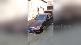 Car gets stuck in wet cement