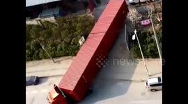 How's this for reverse parking? Driver backs up huge truck into narrow warehouse entrance