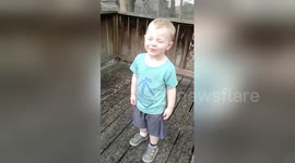 Newsflare Edit - Toddler experiences PURE JOY standing in the rain!