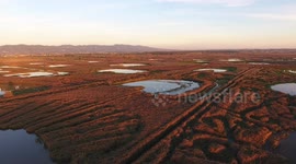 Aerial shot, fly over marshy landscape in Italy, Europe, made with drone, 4K