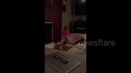 Baby plays hide and seek with her shadow