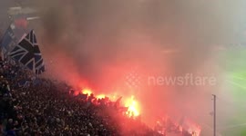 Hamburg soccer fans let off flares inside stadium during Bundesliga match