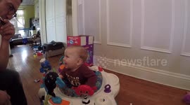 Baby absolutely delighted with harmonica