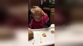 Baby smears peanut butter all over herself