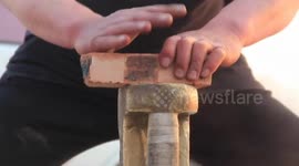 Kung-fu 'doctor' breaks bricks with his bare hands
