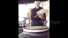 Chinese chef shows off meat cleaver spinning skills