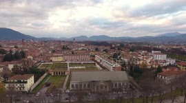 Aerial shot, beautiful panorama of Lucca city, an ancient town in the middle of Tuscany, Italy, filmed with drone, 4K