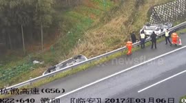 Car flips over out of guardrails on motorway after driver glanced at phone