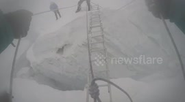 Ladder crevasse crossing at Island Peak