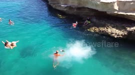 Dog takes impressive leap into sea