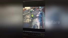 Woman narrowly escapes being crushed by snow falling from rooftop
