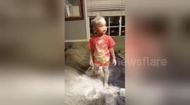 Toddler gets carried away with baby powder