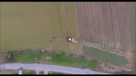 Agriculture in Yorkshire - Aerial Views Red Tractor with a Smoking Bucket