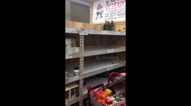 Long queues and empty shelves at supermarket before storm Stella