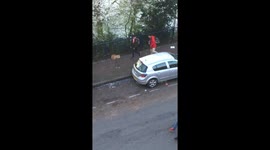 Sevilla Fans kicking boxes at cars
