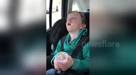 Sleepy toddler won't let go of his ice cream