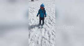 Boy who was told he would never walk skis for the first time