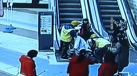Delivery men rescue baby rolling down escalator in buggy