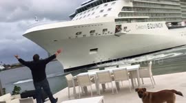 Massive cruise ship comes perilously close to waterfront house