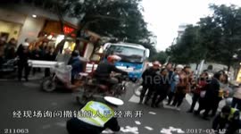 Woman throws bank notes on road in China