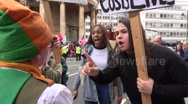 Dancing leprechaun priest brings 'racist' sign to anti-racist protest in London