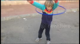 Boy with funny hula hoop style
