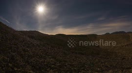 Time Lapse: Moon Setting Over Purple Wildflowers in Anza-Borrego Desert Badlands