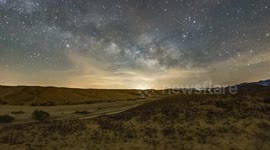 Time Lapse: Milky Way over a patch of purple windflowers in the Anza-Borrego Desert