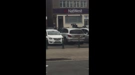Armed police arrest suspected Birmingham bank robber.