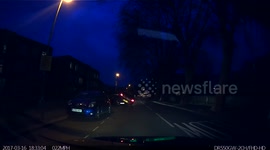 Dozy woman driver mounted two parked cars caught on dashcam.