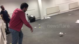 Lad nails trick shot, kicking football through window off a wall