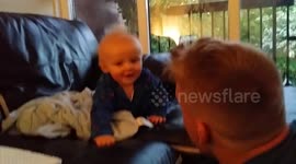 Baby laughs hysterically at peekaboo