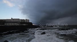 Ominous storm sweeps across the sea off Northern Ireland