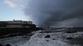 Newsflare Edit - Ominous storm sweeps across the sea off Northern Ireland