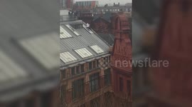 Daredevil slides down roof of 70ft high building