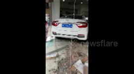 Out-of-control car crashes into clothes shop in China