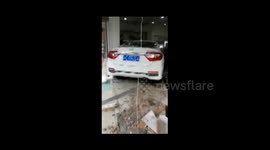 Out-of-control car crashes into clothes shop in China