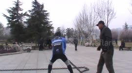 Chinese elderly man plays 90 kg iron whip in park