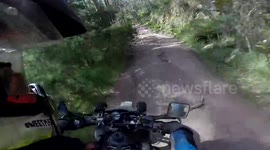 Biker falls off cliff in terrifying crash