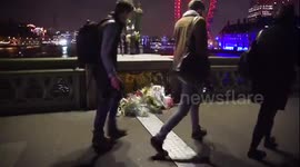 Flowers on Westminster bridge in tribute to victims of terror attack