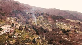 Aerial video of a bonfire in the middle of a landscape in Tuscany, Italy, 4K