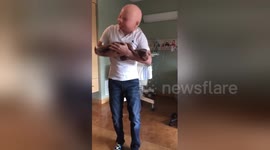 Man dances in baby mask to cheer up partner in labour
