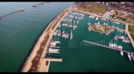 Aerial shot of small port in the winter sunset in Pisa Tuscany Italy filmed with drone, 4K