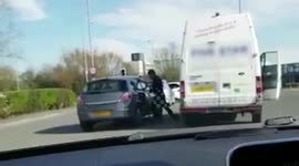 Shocking moment an outnumbered driver is repeatedly punched