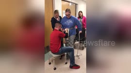 Woman walks for the first time after bleeding in her brain left her paralysed