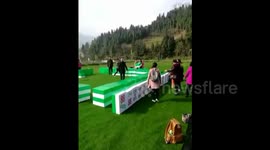Chinese people play giant mahjong in tourist attraction