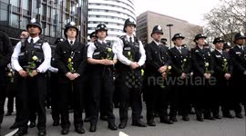 Police officers and civilians pay tribute to victims of Westminster terror attack